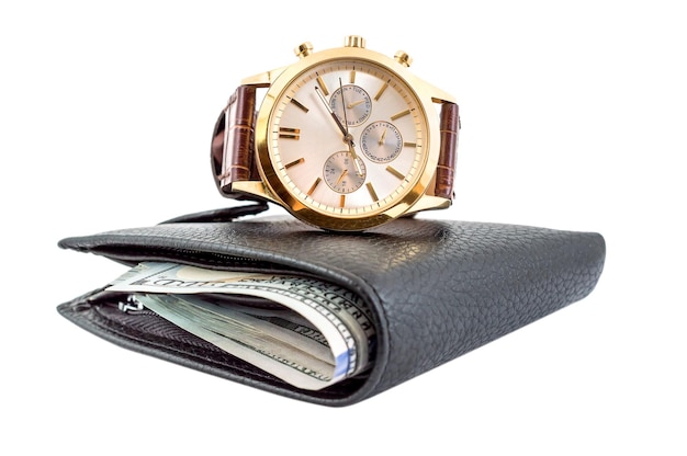 Mechanical wrist watch and wallet with money on a white