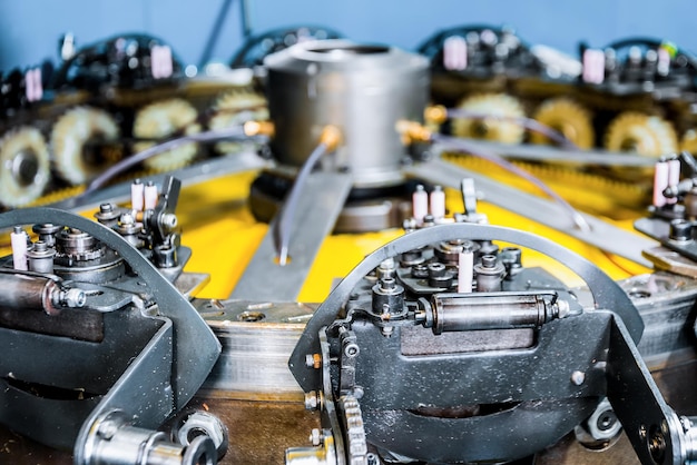 The mechanism of a braiding machine closeup