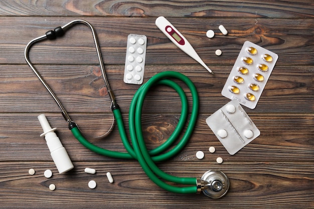 Medical background Many different various medicine tablets or pills on the table with stethoscope Close up Healthcare pharmacy and medicine concept