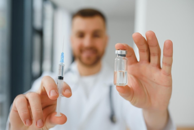 Medical doctor holds vaccine for a patient