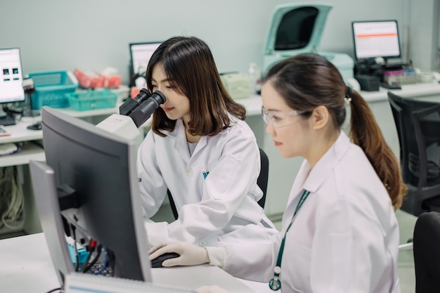 Medical doctor working for analyzing blood samples in laboratory of scientific research.