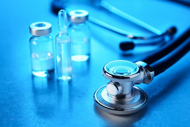 Photo medical doctors stethoscope on the blue table. macro shot