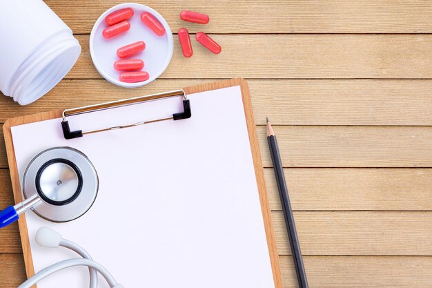 Photo medical equipment on wooden doctor desk background