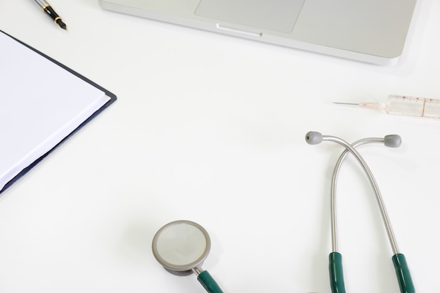 Medical equipment on work table with stethoscope.