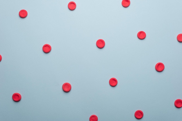 Medical flatlay erythrocytes on a blue background