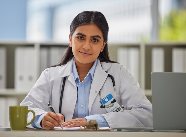 Medical focus and portrait of doctor in office for consulting report and paperwork Medicine healthcare and checklist with woman writing in hospital for prescription wellness exam and results