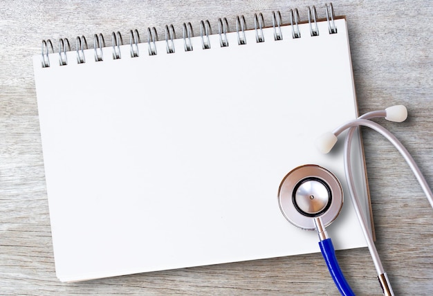 Photo medical healthy equipment workplace of a doctor stethoscope on wooden desk background