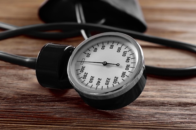 Medical manometer on a wooden background