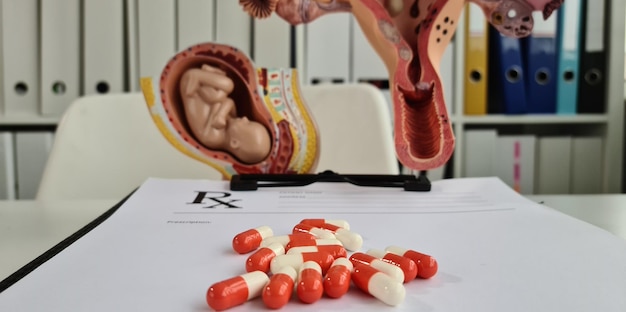 Medical pills prescription baby fetus and uterus closeup