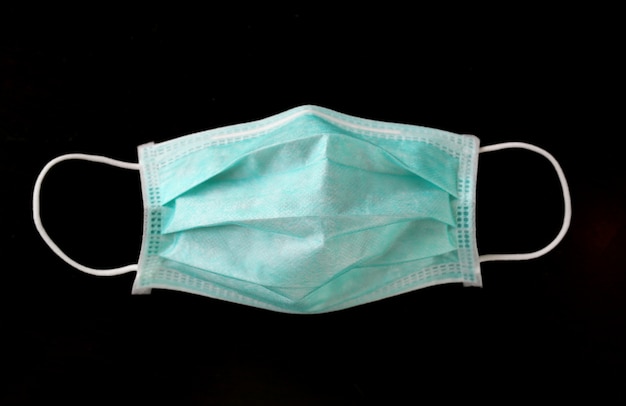 Medical shielding bandage mask isolated on black background