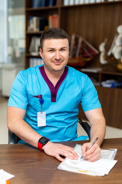 Medical specialist in blue uniform working with documets Professional physician practitioner healthcare treatment