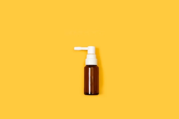 Medical sprayer bottle on a yellow background