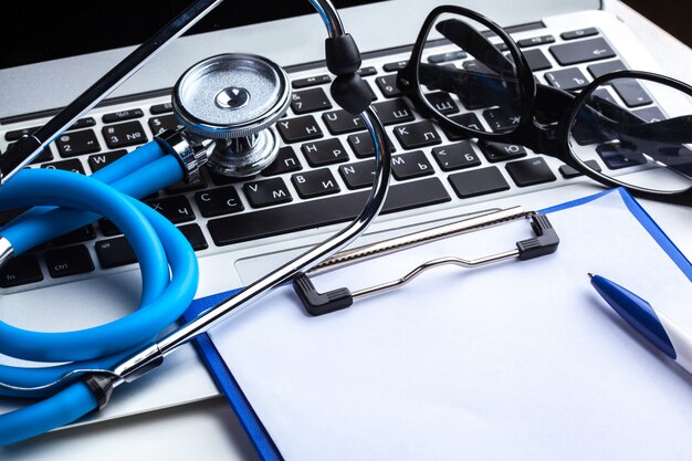 Medical stethoscope on computer keyboard 