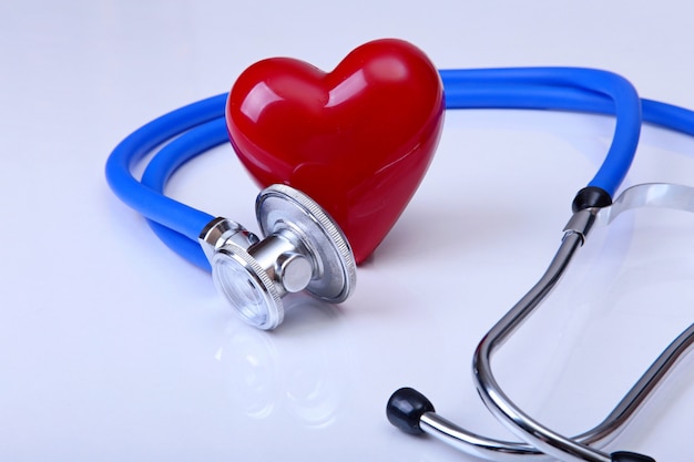 Medical stethoscope and red heart isolated