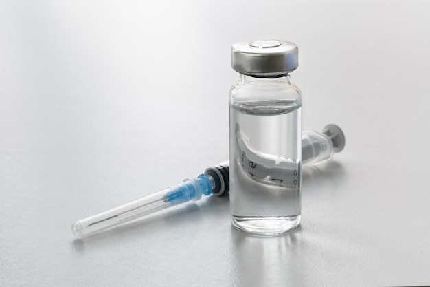 Medical supplies on white table Vaccination concept