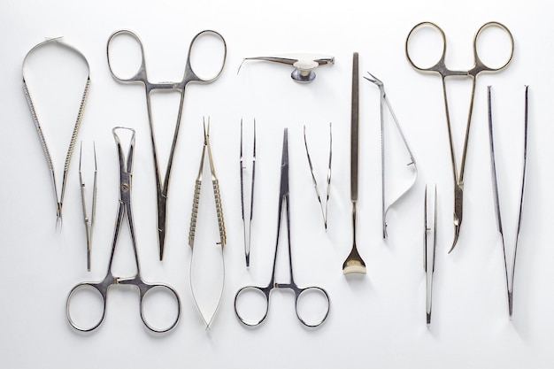 Medical surgical instruments ophthalmological laid out on white background