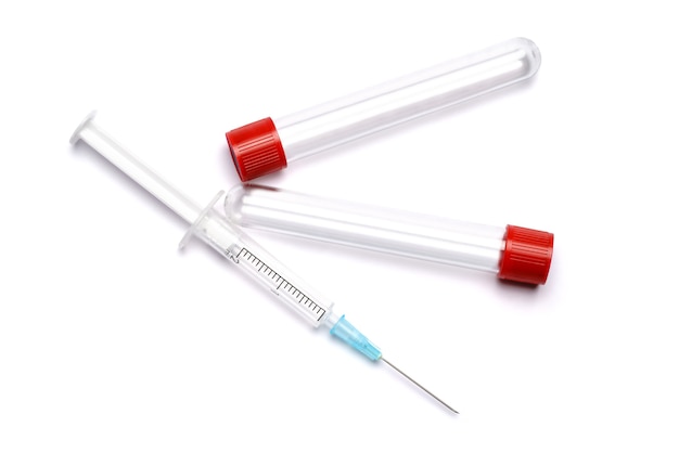 Medical syringe and plastic test tube isolated on white.