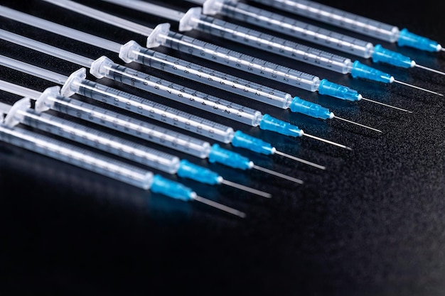 Medical Syringes Needle on Black Background, Close up Syringe