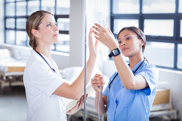 Medical team preparing an IV drip at the hospital