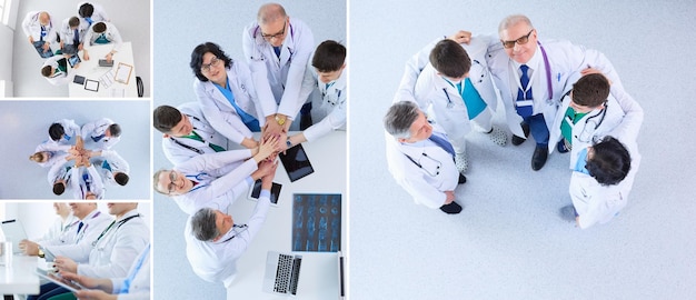 Medical team sitting and discussing at table top view