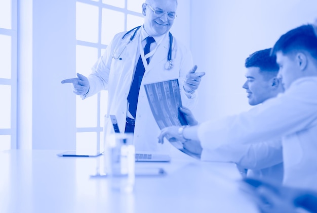 Medical team sitting and discussing at table