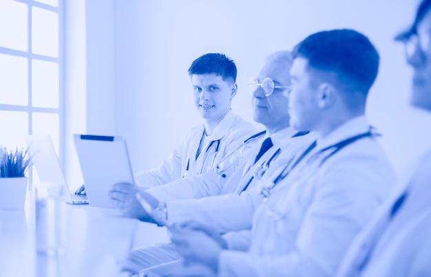 Medical team sitting and discussing at table