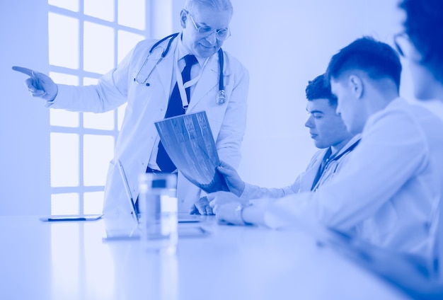 Medical team sitting and discussing at table