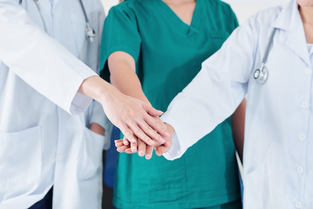 Medical team stacking hands