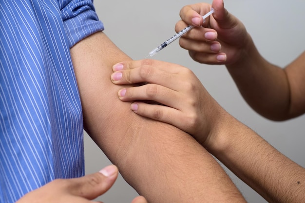 Medical worker injecting insulin dose to the patient