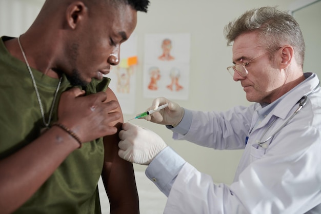 Medical Worker Injecting Vaccine