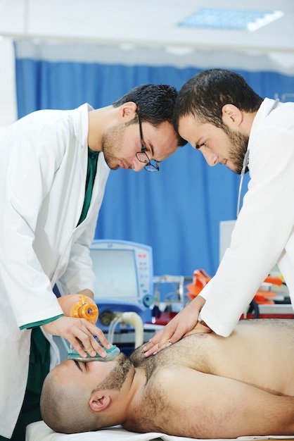 Medical workers taking care of patient at modern hospital