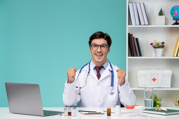 Medical working remotely on computer serious cute smart doctor in lab coat excited