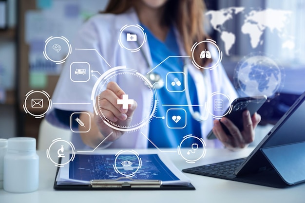 Medicine doctor using digital tablet and smartphone diagnose virtual electronic medical record on interfaceDigital healthcare and network on virtual medical technology xA