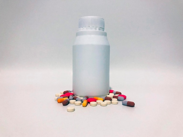 Medicine Pills or Tablets Drop and Out of the White Plastic Bottle.