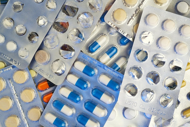 Medicine pills and tablets with blister packs turning