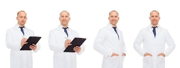 medicine, profession and health care concept - happy doctors with clipboard and stethoscope