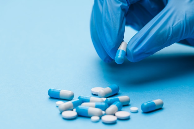 Medicine tablets vitamins on the table in the group