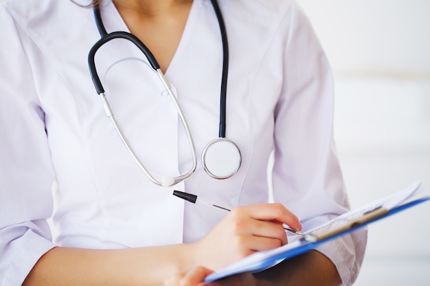 Medicine, Young female doctor in modern clinic