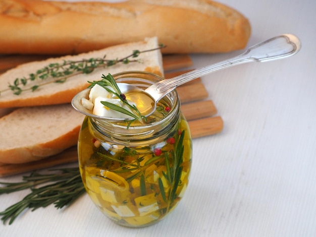 Mediterranean appetizer cheese with herbs in olive oil