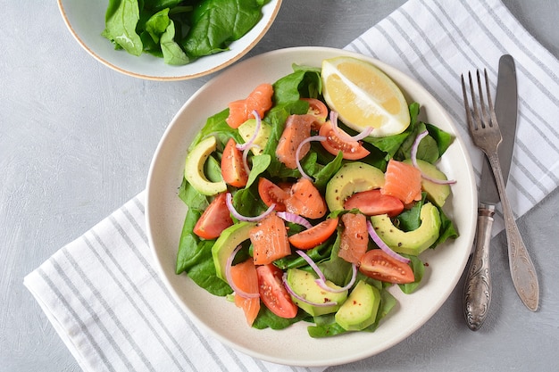 Mediterranean avocado salmon salad with spinach