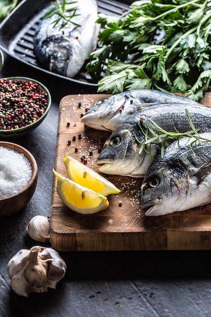 Mediterranean fish bream with spices salt herbs garlic and lemon. Healthy seafood. Concept of healthy sea food.