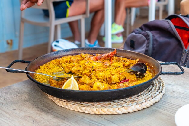 Mediterranean paella rice meal with seafood on the coast of Ibiza