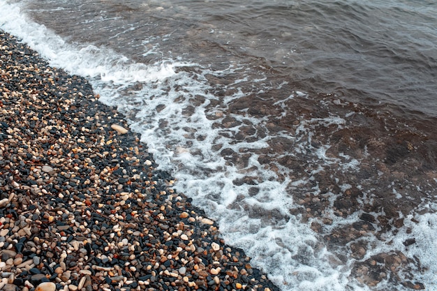 Mediterranean Sea waves on the pebble beach in Cyprus