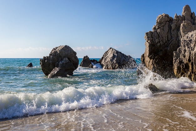 Mediterranean seascape, blue sea, rocks on the coast, summer day. Calabrian beach, near Tropea