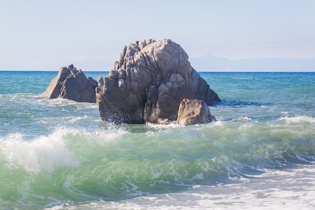 Mediterranean seascape, blue sea, rocks on the coast, summer day