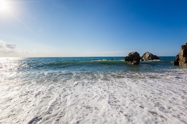 Mediterranean seascape, blue sea, rocks on the coast, summer day