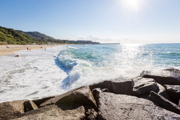 Mediterranean seascape, blue sea, rocks on the coast, summer day