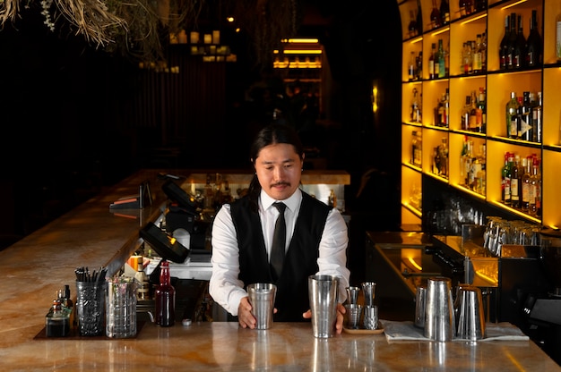 Medium shot bartender preparing drink