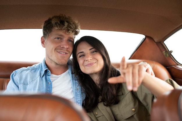 Medium shot couple in car