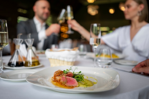 Medium shot couple having  lunch in luxury restaurant